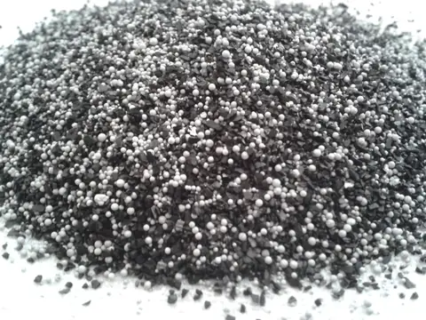 The black and white granules from inside a household water filter