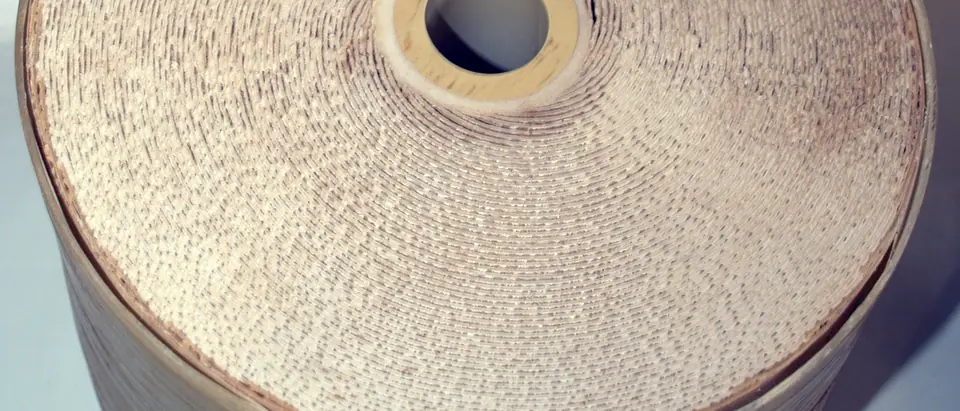 The end of a spiral-wound reverse osmosis membrane element, its layers rolled around a center tube
